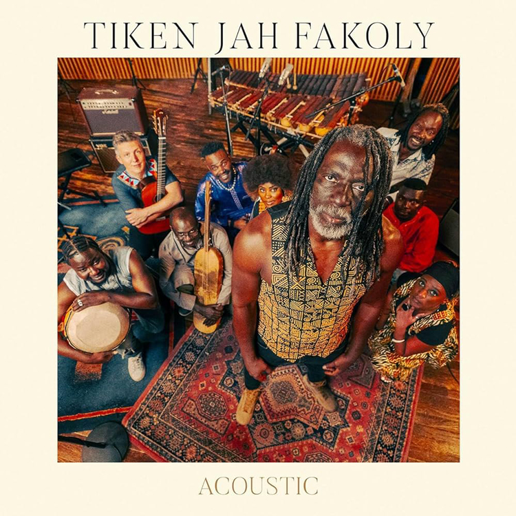 Tiken Jah Fakoly - Acoustic cover artwork. A photo of Tiken and his band.