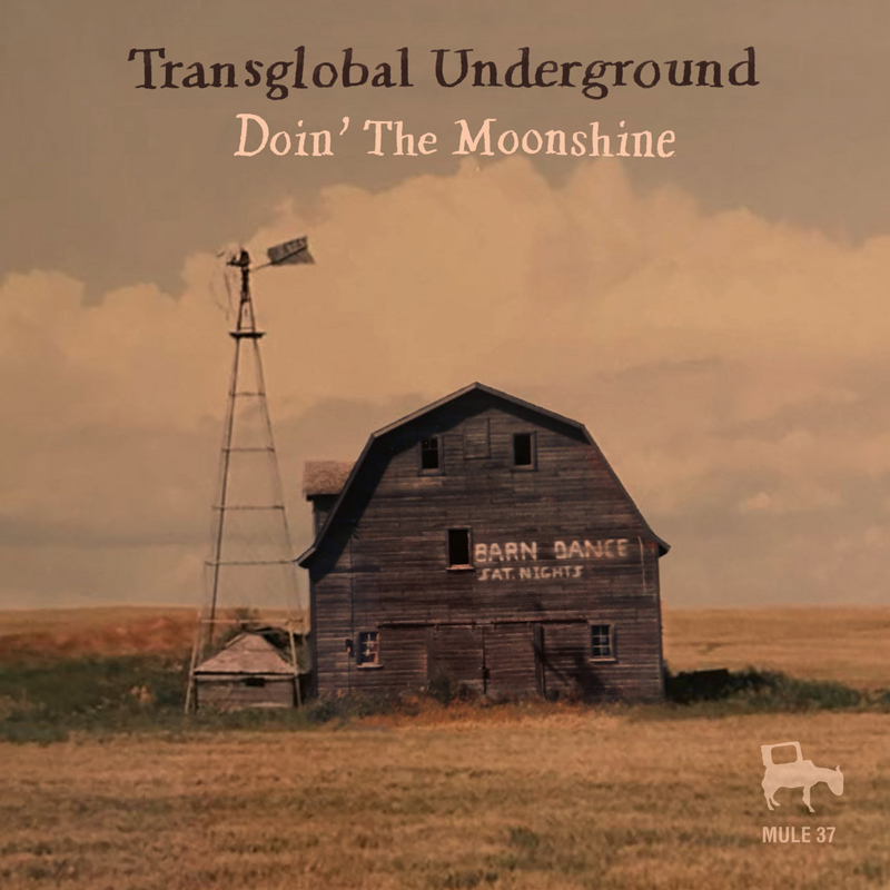 Transglobal Underground - Doin’ the Moonshine cover artwork. A photo of a large barn next to a windmill.