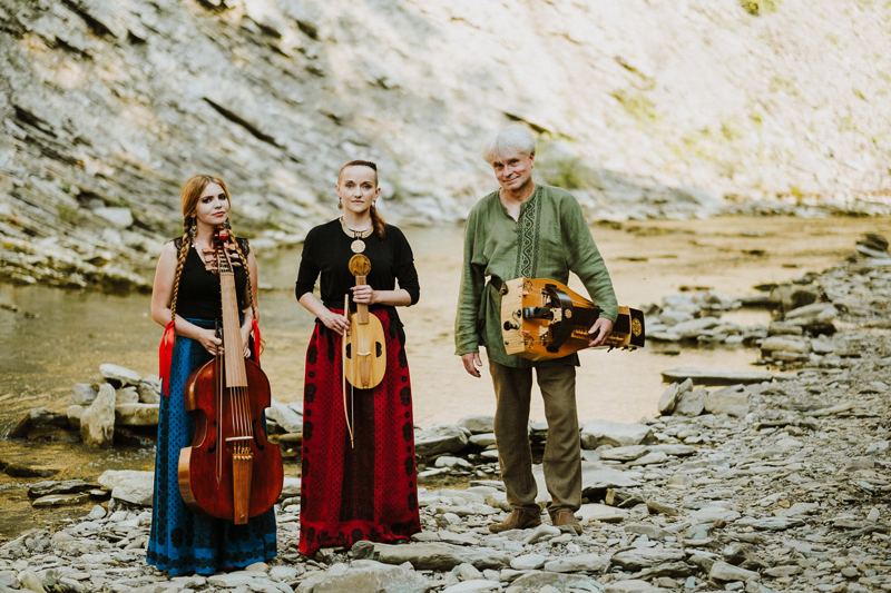 Wernyhora - Photo by Adam Jaremko. Outdoor photo of the band in a mountain environment holding their instruments.