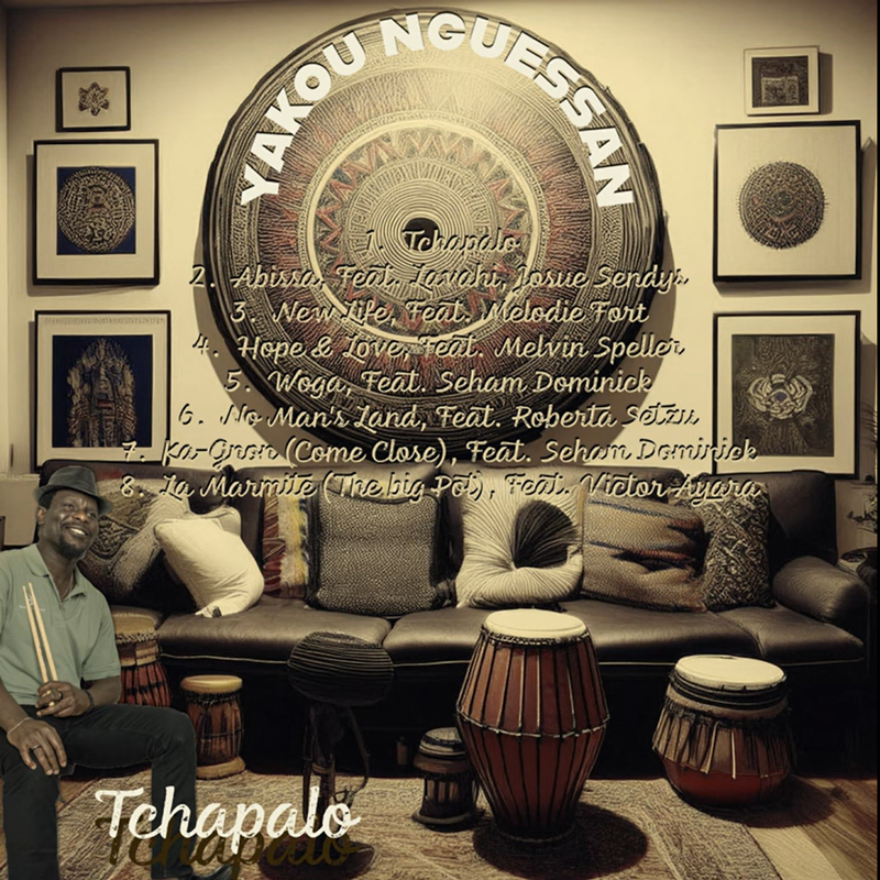 The album cover for Tchapalo by Yakou Nguessan features a living room scene adorned with traditional African art and percussion instruments. The artist is pictured smiling in the lower left corner, holding drumsticks. The track list, written in a handwritten-style font, includes collaborations with various musicians.
