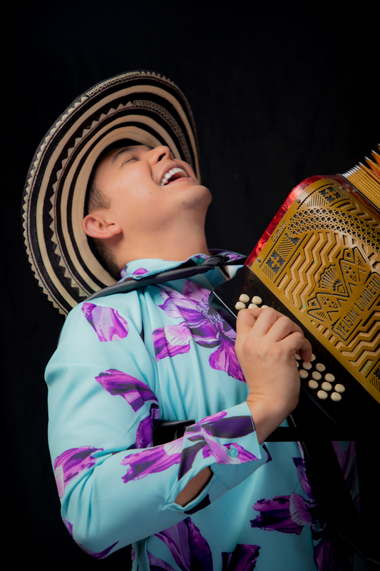 Yeison Landero - Photo by Alex Guete. Yeison Landero playing the acordion.
