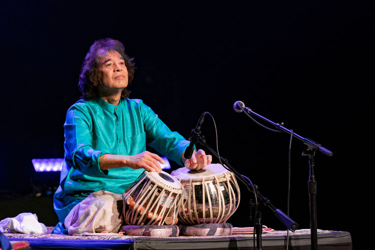Zakir Hussain - Photo by Jim Bennett. Zakir playing tabla live.