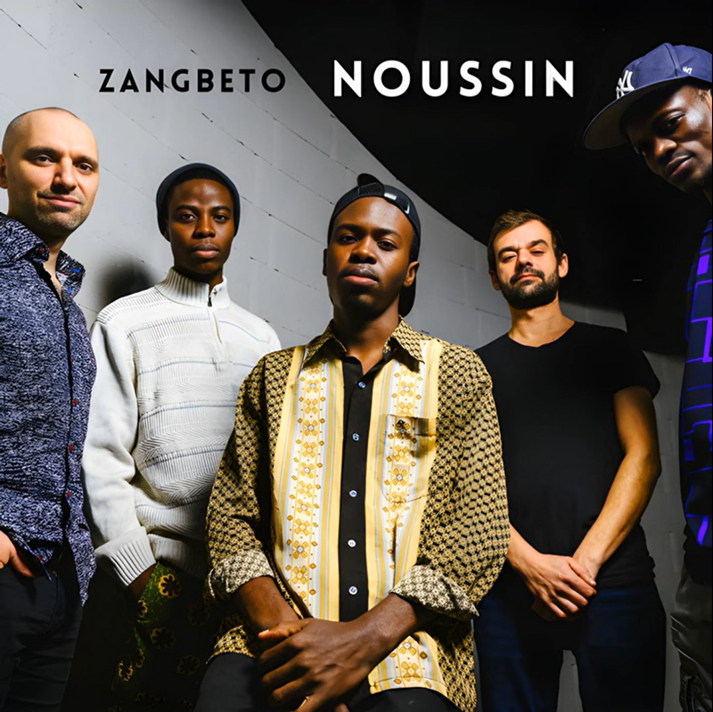 Zangbeto Noussin artwork. A photo of 5 men, three black and two white.