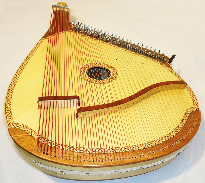 A photo of a Ukrainian bandura string instrument. Trembita brand.