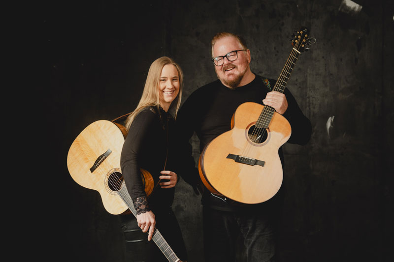 Don Ross and Julie Malia -Photo by Max Bollow. Both artists holding guitars