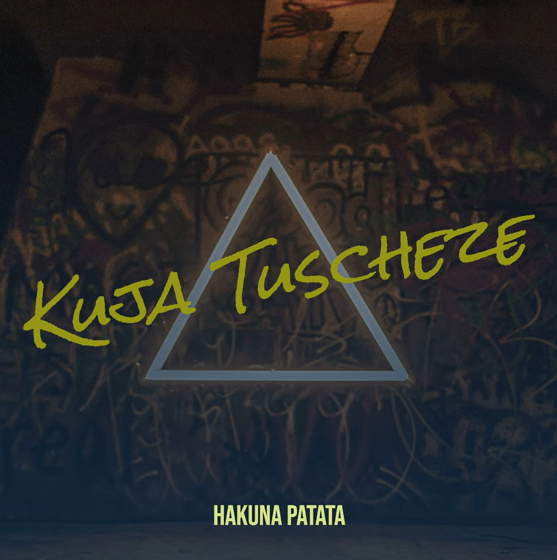 The single cover features the title Kuja Tuscheze written in bold, neon-yellow graffiti-style text over a glowing triangle. The background is dark and gritty, covered in layered graffiti art. At the bottom, in smaller block letters, is the artist name Hakuna Patata.