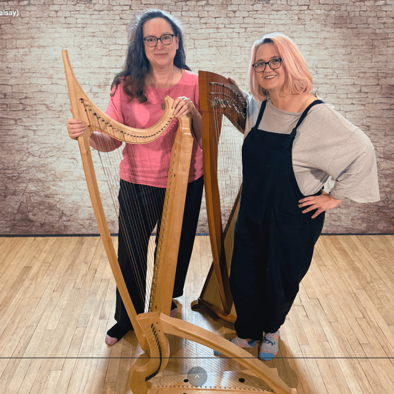 Lauren Scott and Karen Marshalsay - "The Meeting of Friends". A photo of the two artists standing, holding their harps.