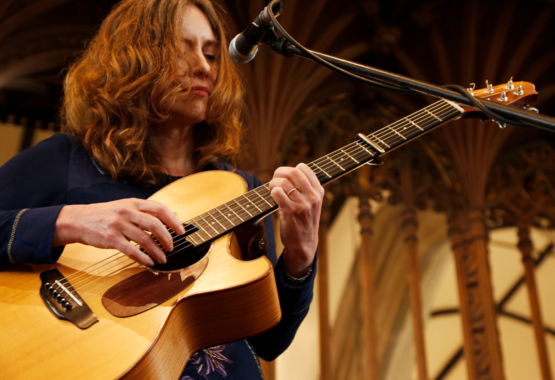 Sarah McQuaid playing guitar - Photo by Mawgan Lewis